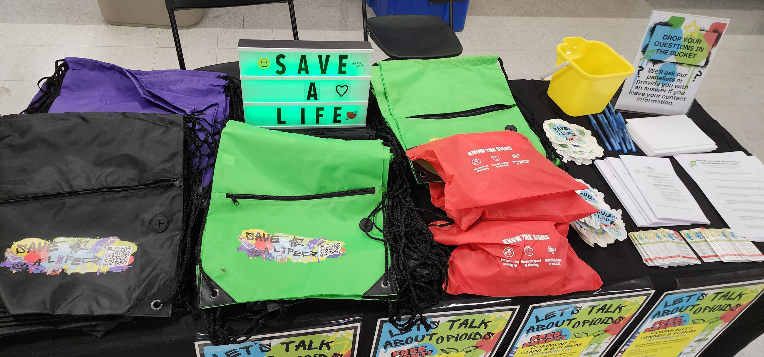 Table display with bags and harm reduction kits